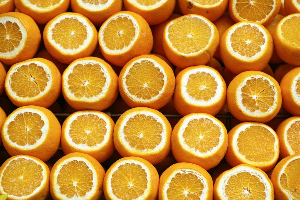 Oranges lined up in rows.